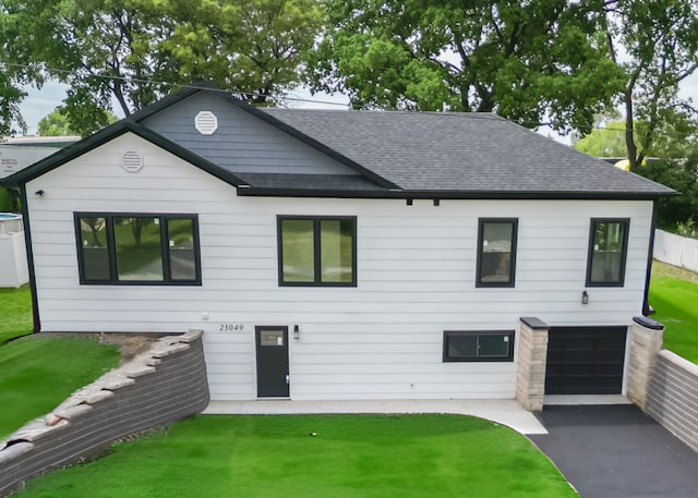 23049 W Andrew Ave, Channahon, IL 60410 - view of front of home featuring roof with shingles, a front lawn, driveway, and an attached garage