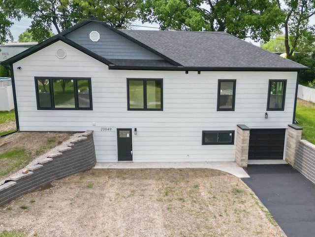 23049 W Andrew Ave, Channahon, IL 60410 - back of house featuring roof with shingles, asphalt driveway, and a garage