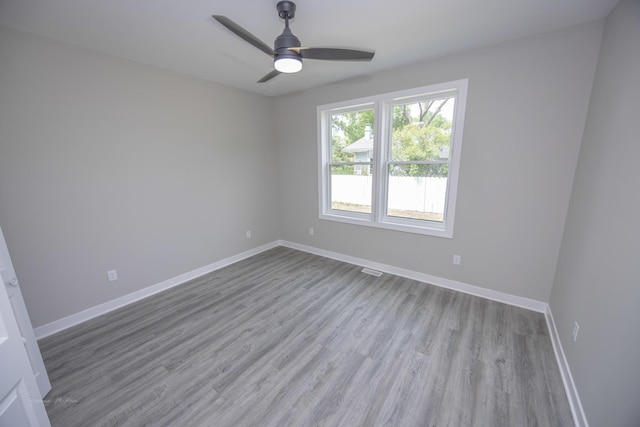 23049 W Andrew Ave, Channahon, IL 60410 - empty room featuring wood finished floors, baseboards, and a ceiling fan