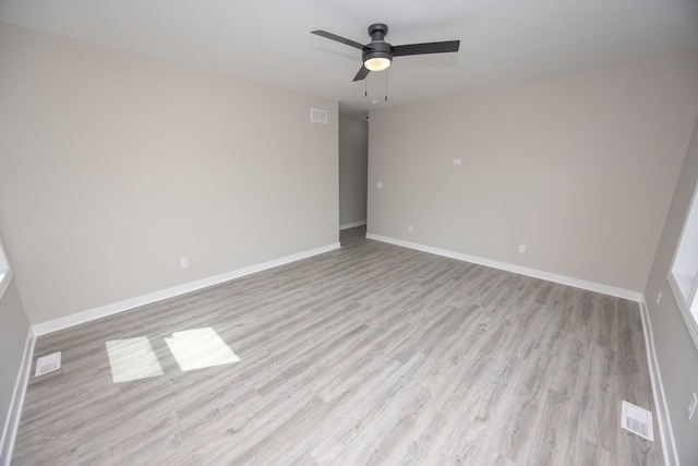 23049 W Andrew Ave, Channahon, IL 60410 - empty room featuring light wood-style floors, a ceiling fan, and baseboards