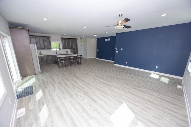 23049 W Andrew Ave, Channahon, IL 60410 - living area featuring a ceiling fan, recessed lighting, baseboards, and light wood-style flooring