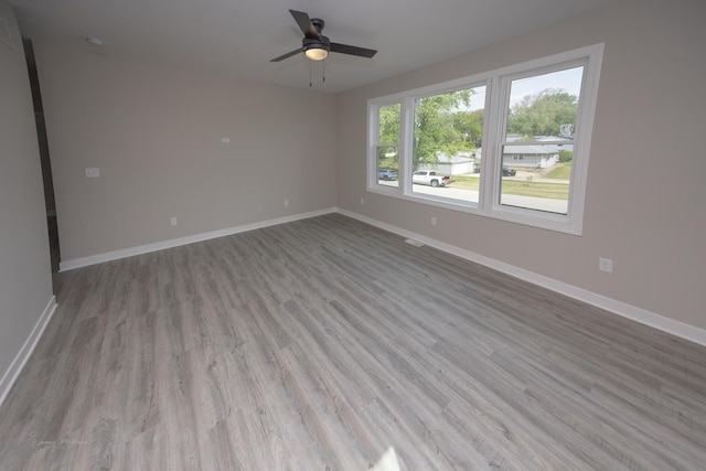 23049 W Andrew Ave, Channahon, IL 60410 - unfurnished room with wood finished floors, a ceiling fan, and baseboards