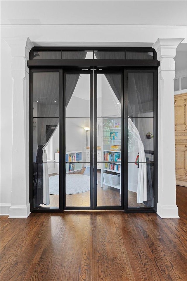 1313 N Wood St Unit 2, Chicago, IL 60622 - unfurnished room featuring baseboards, wood finished floors, and ornate columns