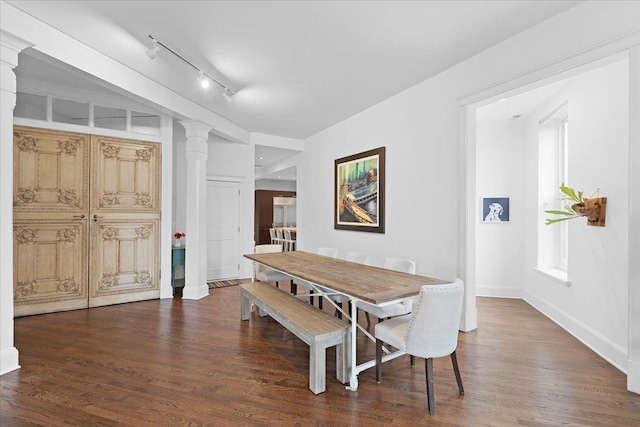 1313 N Wood St Unit 2, Chicago, IL 60622 - dining room featuring rail lighting, decorative columns, and wood finished floors