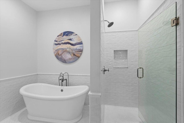 1313 N Wood St Unit 2, Chicago, IL 60622 - full bath featuring a wainscoted wall, a stall shower, tile patterned floors, a soaking tub, and tile walls