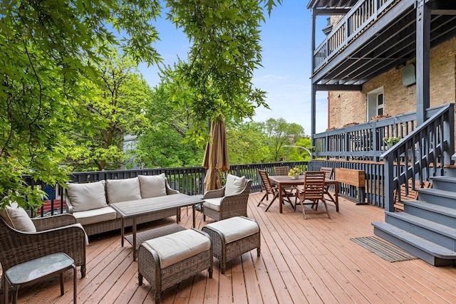 1313 N Wood St Unit 2, Chicago, IL 60622 - wooden deck with an outdoor living space, outdoor dining area, and stairs