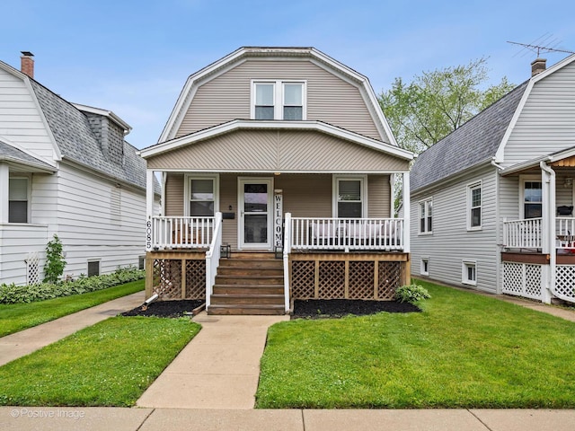 6085 N Nassau Ave, Chicago, IL 60631 - colonial inspired home with a porch, a gambrel roof, and a front lawn