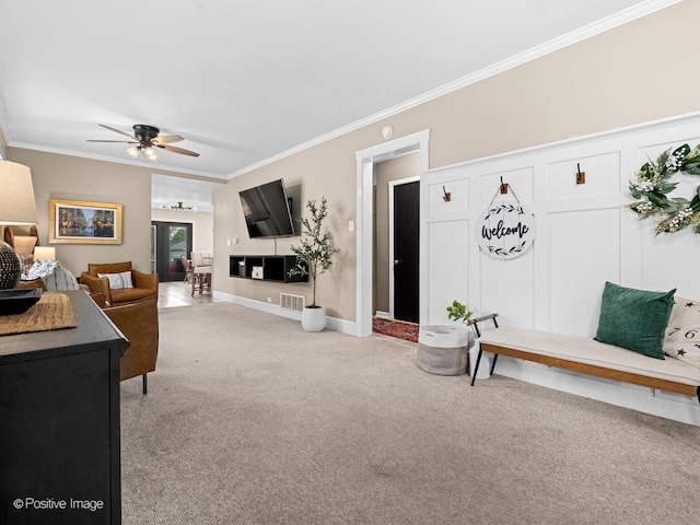6085 N Nassau Ave, Chicago, IL 60631 - living area featuring light colored carpet, ornamental molding, and a ceiling fan