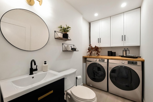 bathroom featuring washer and clothes dryer, toilet, recessed lighting, vanity, and tile patterned floors