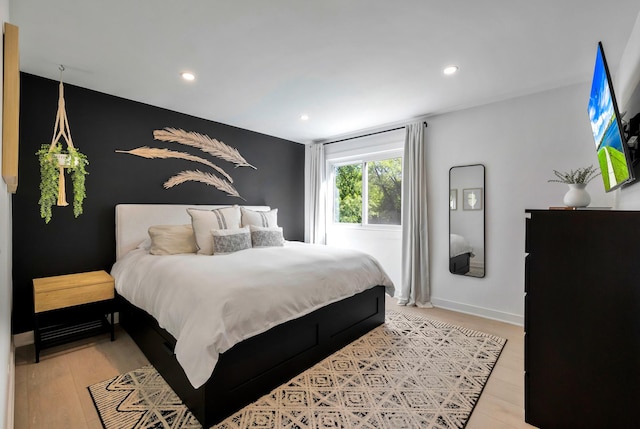 bedroom with light wood-style flooring, recessed lighting, and baseboards