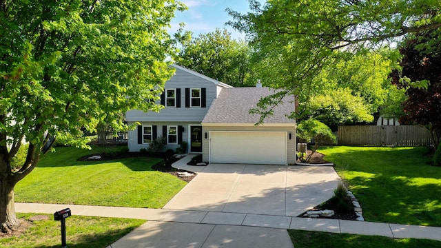 view of front of home with a garage, driveway, and roof with shingles