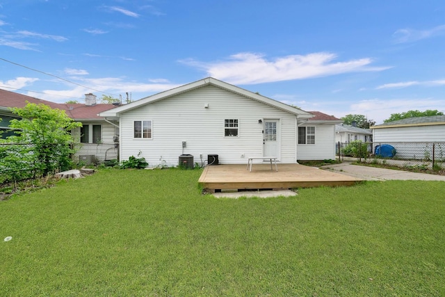 back of house featuring a wooden deck and central AC