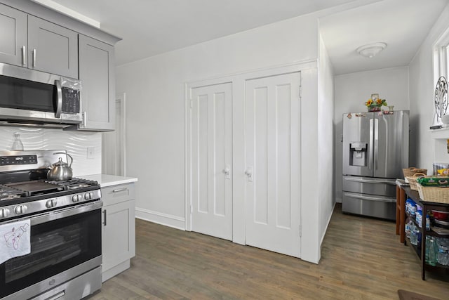2018 N Laporte Ave, Chicago, IL 60639 - kitchen with stainless steel appliances, dark wood-style floors, gray cabinets, and light countertops