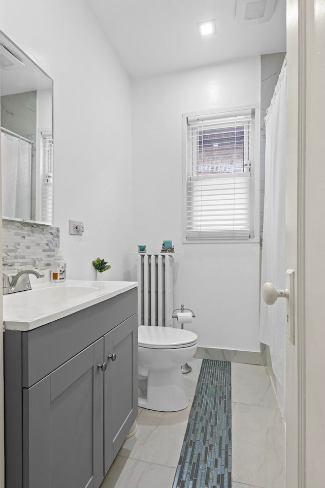 2018 N Laporte Ave, Chicago, IL 60639 - bathroom with decorative backsplash, radiator, toilet, and vanity