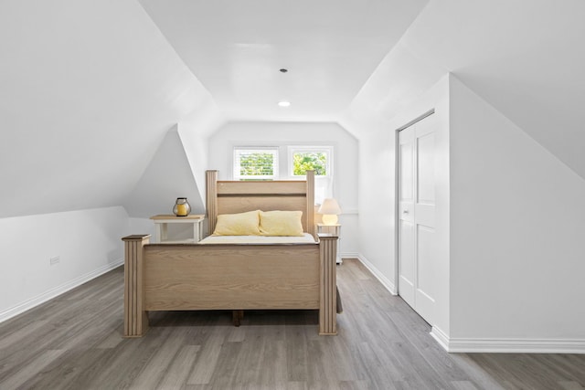 2018 N Laporte Ave, Chicago, IL 60639 - bedroom featuring vaulted ceiling, wood finished floors, and baseboards