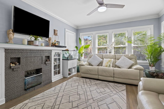 2018 N Laporte Ave, Chicago, IL 60639 - living area with wood finished floors, ornamental molding, a ceiling fan, and a tile fireplace