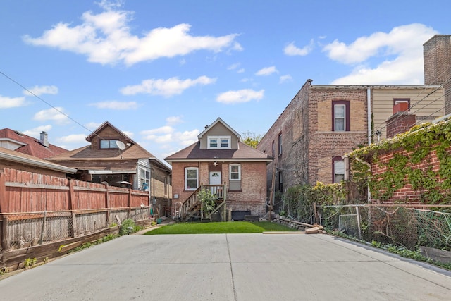 2018 N Laporte Ave, Chicago, IL 60639 - view of front facade with brick siding and fence