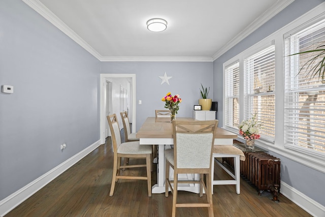 2018 N Laporte Ave, Chicago, IL 60639 - dining area featuring radiator heating unit, crown molding, baseboards, and dark wood finished floors
