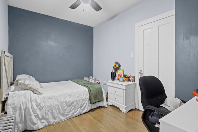 2018 N Laporte Ave, Chicago, IL 60639 - bedroom with light wood-style flooring, ceiling fan, and an office area