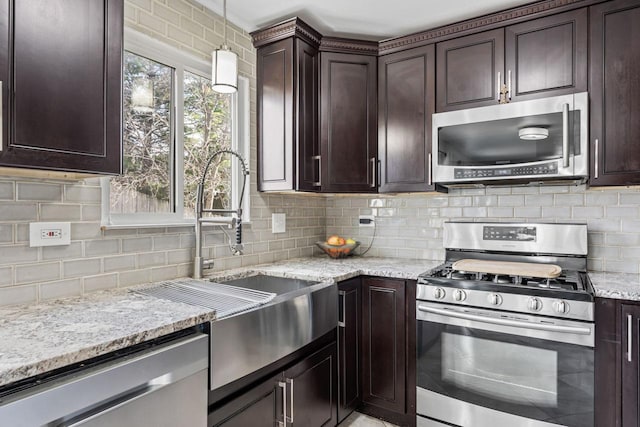 576 Aspen Dr, Lombard, IL 60148 - kitchen featuring appliances with stainless steel finishes, light stone counters, tasteful backsplash, and dark brown cabinetry