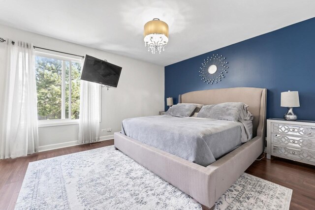 576 Aspen Dr, Lombard, IL 60148 - bedroom with wood finished floors, a chandelier, and baseboards