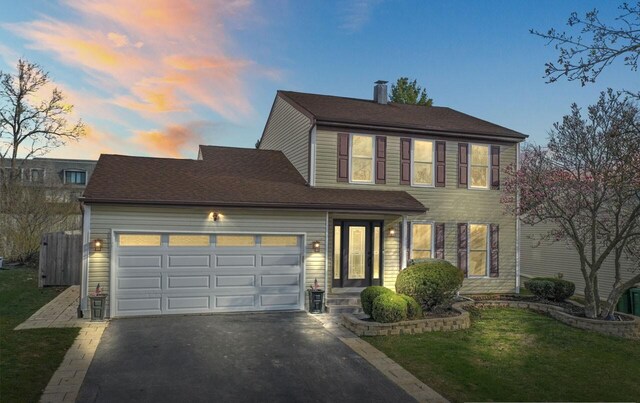 576 Aspen Dr, Lombard, IL 60148 - view of front of property with asphalt driveway and a garage