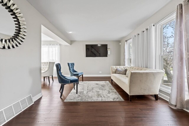 576 Aspen Dr, Lombard, IL 60148 - living area with healthy amount of natural light, dark wood-style flooring, and baseboards