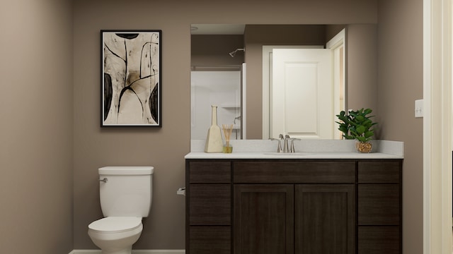 bathroom featuring toilet, baseboards, and vanity
