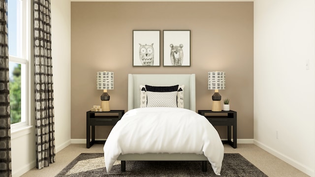 bedroom featuring light carpet and baseboards
