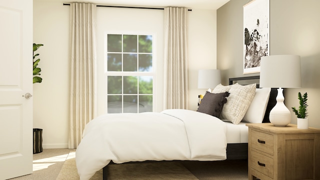 bedroom featuring light carpet and baseboards