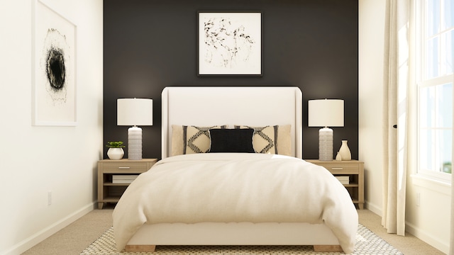 bedroom featuring carpet and baseboards