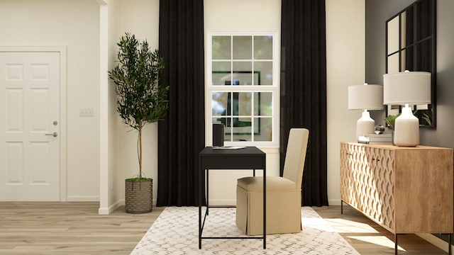 home office featuring wood finished floors and baseboards
