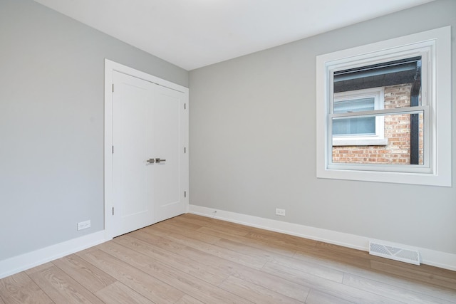 7306 W Pensacola Ave, Norridge, IL 60706 - unfurnished room with light wood-style flooring and baseboards