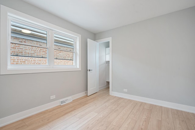 7306 W Pensacola Ave, Norridge, IL 60706 - unfurnished room with light wood-type flooring and baseboards
