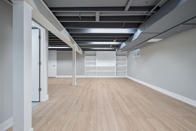 7306 W Pensacola Ave, Norridge, IL 60706 - finished basement with light wood-type flooring and baseboards