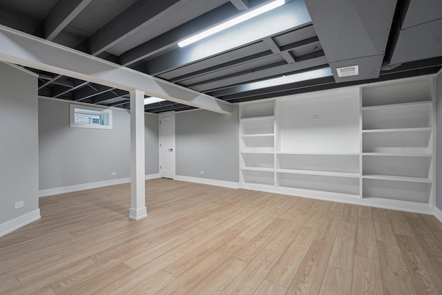 7306 W Pensacola Ave, Norridge, IL 60706 - below grade area featuring light wood-style flooring and baseboards