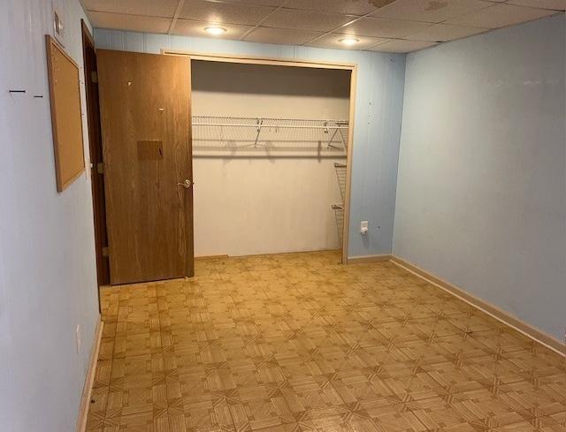 20827 W Torrey Pines Ln, Plainfield, IL 60544 - unfurnished bedroom with a drop ceiling, baseboards, and a closet