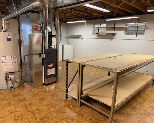 20827 W Torrey Pines Ln, Plainfield, IL 60544 - unfinished below grade area featuring water heater and washer and clothes dryer