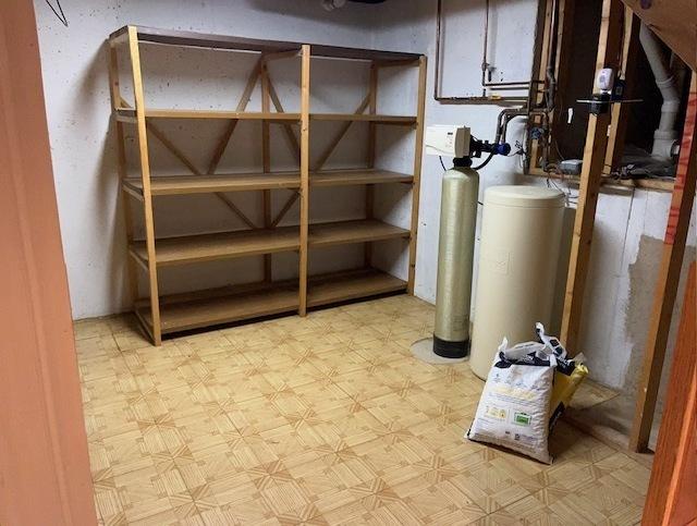 20827 W Torrey Pines Ln, Plainfield, IL 60544 - unfinished below grade area with tile patterned floors and a water softener
