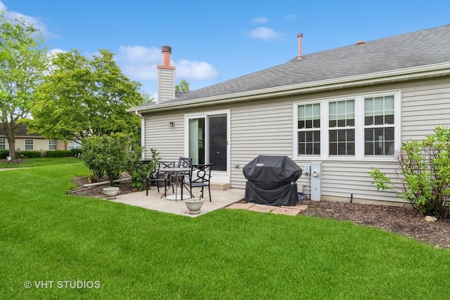 20827 W Torrey Pines Ln, Plainfield, IL 60544 - back of house featuring a patio, a lawn, and a chimney