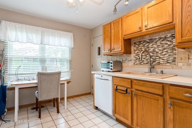 20827 W Torrey Pines Ln, Plainfield, IL 60544 - kitchen featuring dishwasher, a sink, decorative backsplash, and light countertops