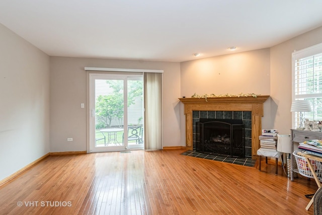 20827 W Torrey Pines Ln, Plainfield, IL 60544 - living room with hardwood / wood-style flooring, a tile fireplace, and baseboards