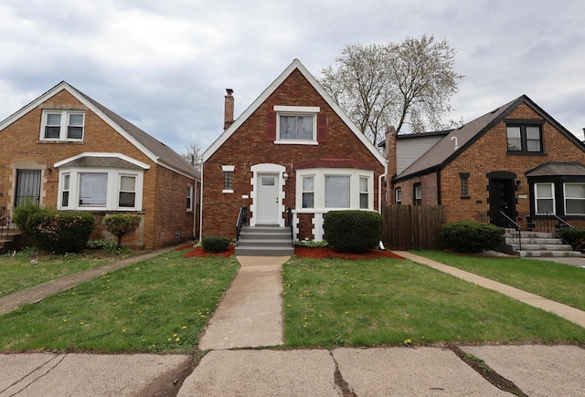 10817 S Eberhart Ave, Chicago, IL 60628 - view of front of property with a chimney and brick siding