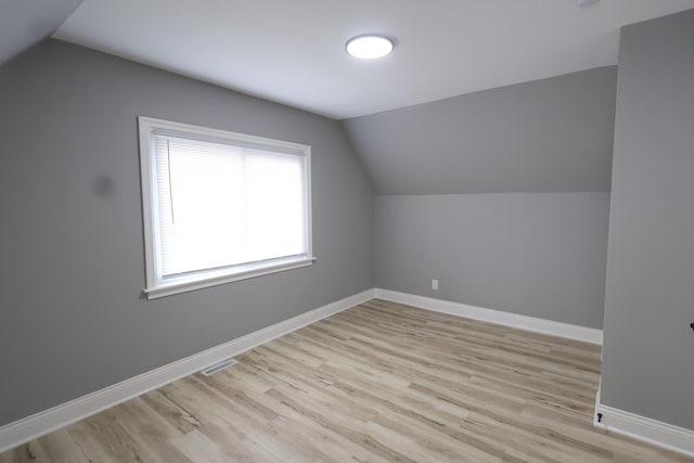 10817 S Eberhart Ave, Chicago, IL 60628 - additional living space featuring lofted ceiling, light wood-style floors, and baseboards