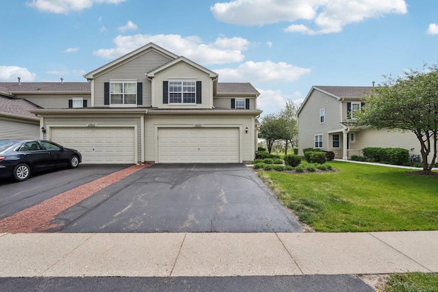 2007 S Kristina Ln, Round Lake, IL 60073 - view of front of home featuring a front yard, driveway, and a garage