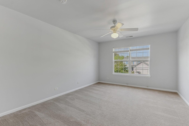 2007 S Kristina Ln, Round Lake, IL 60073 - empty room featuring a ceiling fan, baseboards, and light carpet