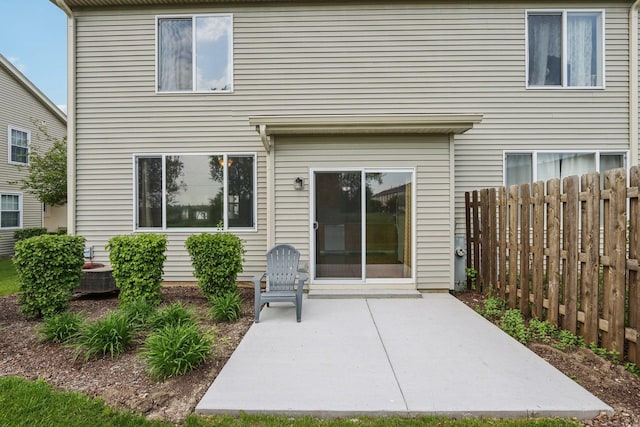 2007 S Kristina Ln, Round Lake, IL 60073 - rear view of house featuring a patio and fence