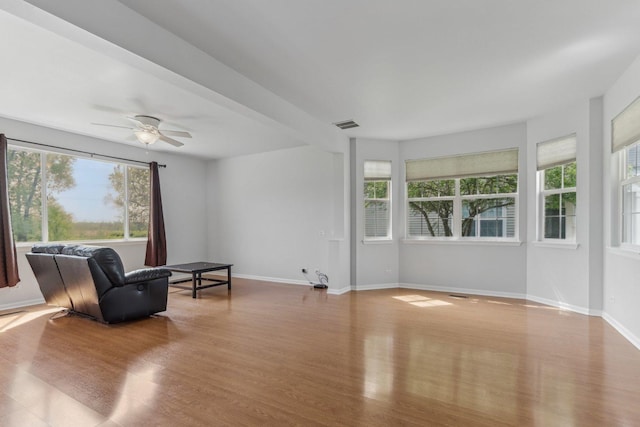 2007 S Kristina Ln, Round Lake, IL 60073 - sitting room featuring plenty of natural light, wood finished floors, baseboards, and a ceiling fan