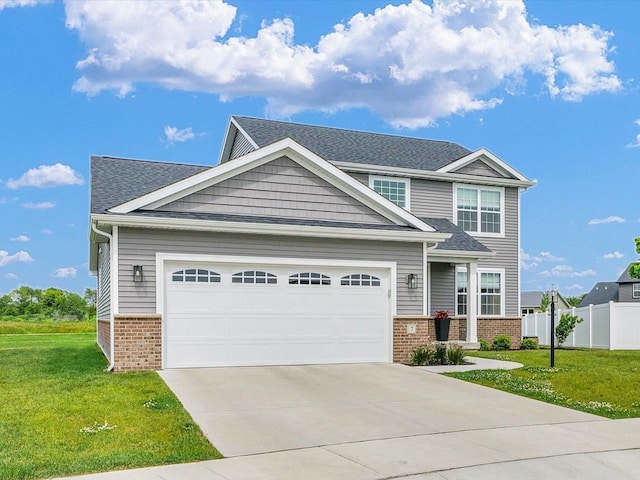 7 Connor Ct, Monticello, IL 61856 - craftsman-style home with brick siding, driveway, roof with shingles, and a garage