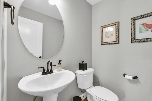 7 Connor Ct, Monticello, IL 61856 - half bathroom featuring a sink and toilet